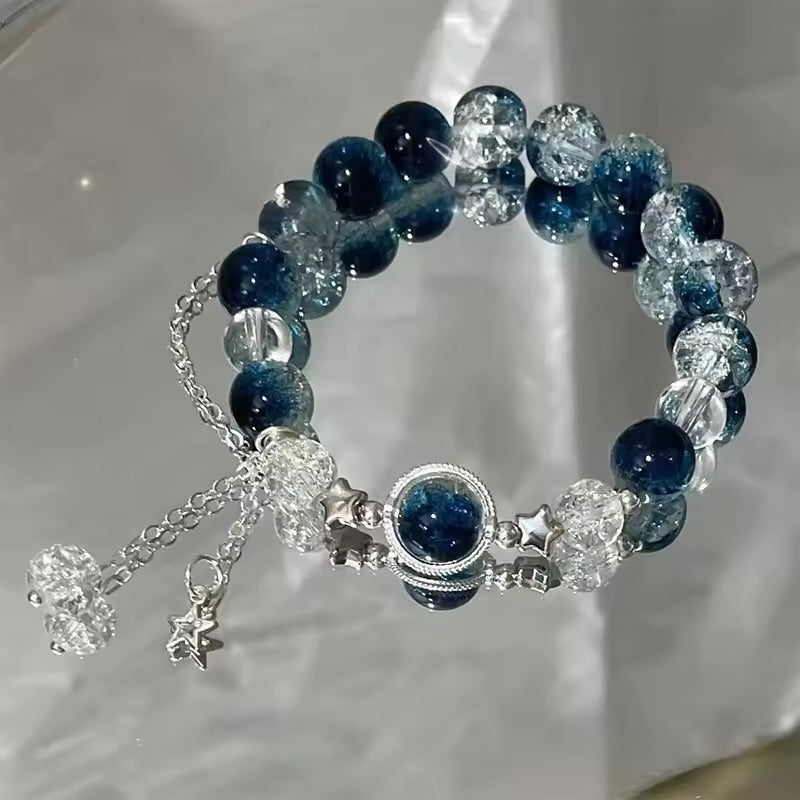 DCFA8D03-F660-447A-ADEE-09760C2CBC7B Exquisite Galaxy Star Tassels Bracelet - Image 1